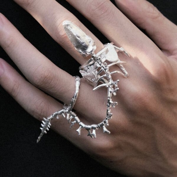 Women Wear White And Dark Bone Ring - Image 2